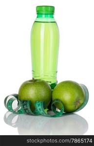Fitness, weight loss concept with green apples, bottle of drinking water and tape measure isolated on white background
