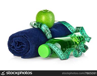 Fitness, weight loss concept with towel, green apple, bottle of drinking water and tape measure isolated on white background