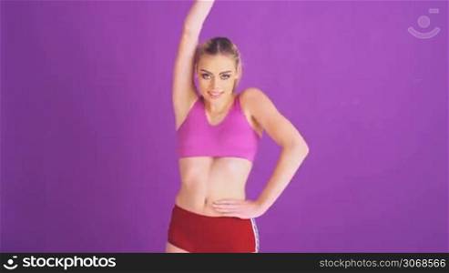 fitness woman dancing on purple