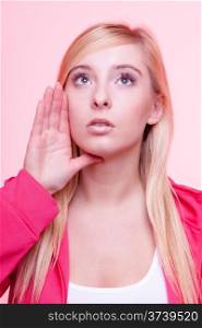Fitness woman in sportwear speaking, young blonde girl whispering pink background