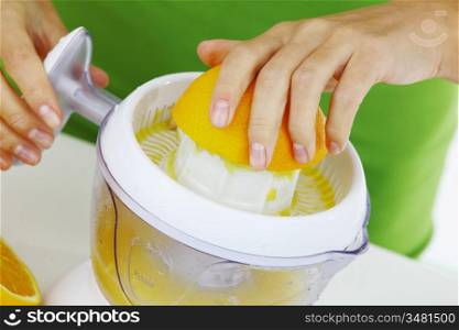 fitness woman make an orange juice