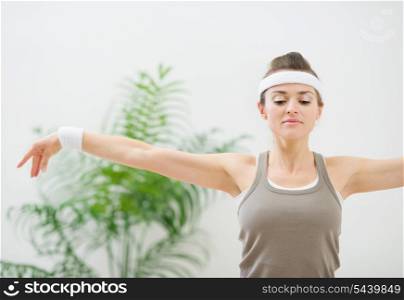 Fitness woman making gymnastics
