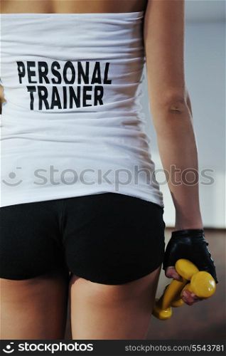 fitness woman personal trainer in sport club indoor
