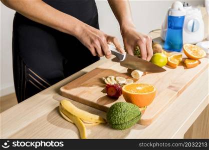 fitness woman preparing detox juice
