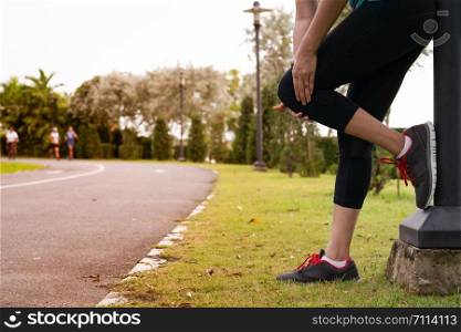 fitness woman runner feel pain on knee. Outdoor exercise activities concept