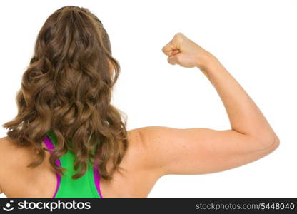 Fitness woman showing biceps . rear view