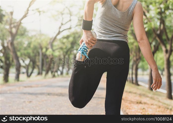 Fitness woman standing yoga posture on the street.