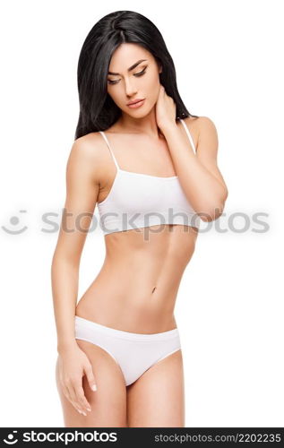 Fitness woman with a beautiful body on white background. Fitness young woman with a beautiful body