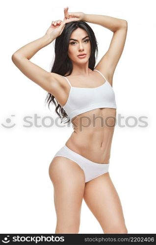 Fitness woman with a beautiful body on white background. Fitness young woman with a beautiful body
