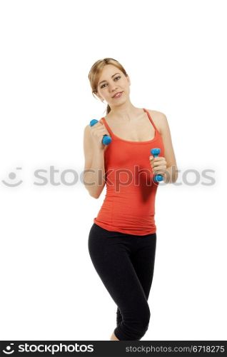 fitness woman with blue dumbbells. young beautiful fitness woman with blue dumbbells on white background