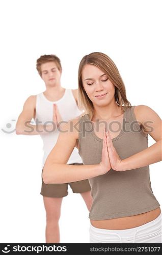 Fitness - Young healthy couple in yoga position on white background