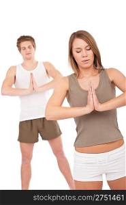 Fitness - Young healthy couple in yoga position on white background