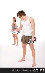 Fitness - Young healthy couple with weights in sportive outfit on white background
