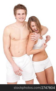 Fitness - Young sportive smiling couple having fun after training on white background