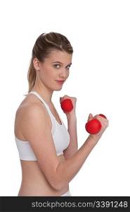 Fitness - Young sportive woman exercise with weights on white background