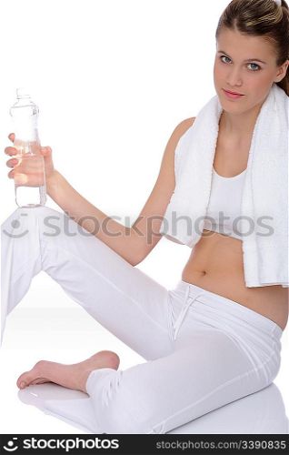 Fitness - Young sportive woman with water and towel on white background