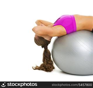 Fitness young woman doing abdominal crunch on fitness ball