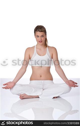 Fitness - Young woman in yoga position on white background