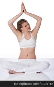 Fitness - Young woman in yoga position on white background