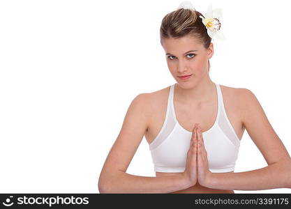 Fitness - Young woman in yoga position on white background relaxing