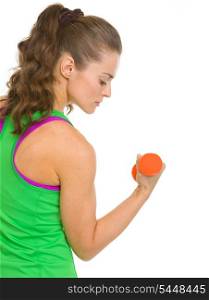 Fitness young woman making exercise with dumbbells