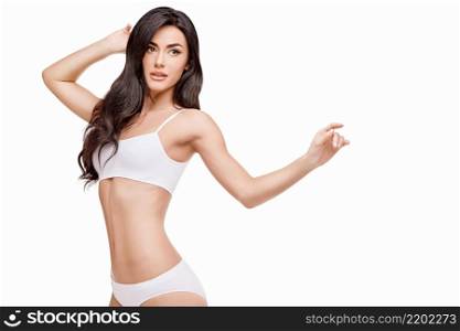 Fitness young woman with a beautiful body isolated on white background. Fitness young woman with a beautiful body on white background