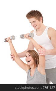 Fitness - Young woman with instructor lifting weights on white background