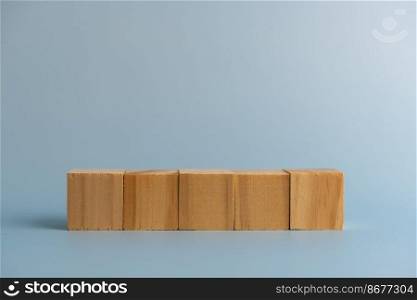 Five blank wooden block cubes on background for your text. Business concept template and banner.