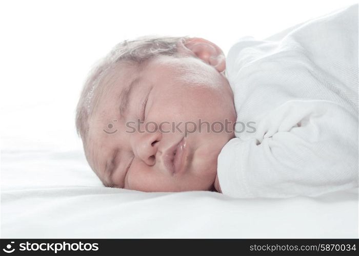 Five days old infant, sleeped on the white