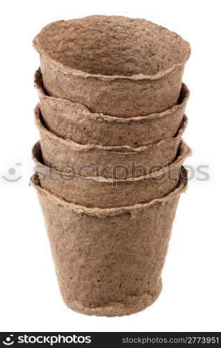 Five empty peat pots over white background