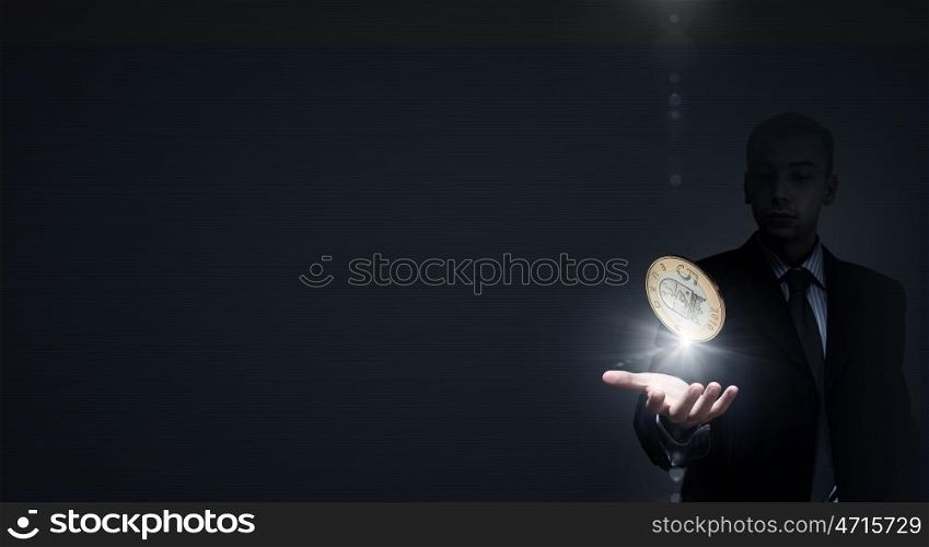 Five euro. Close up of businessman holding in palms euro coin