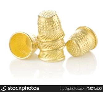 five golden timbles isolated on white background