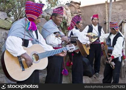 Five guitarists performing, Lake Titicaca, Taquile Island, Puno, Peru