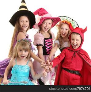 Five Happy Children in Halloween Costumes of Witches, Demon and Princess Showing Thumbs Up