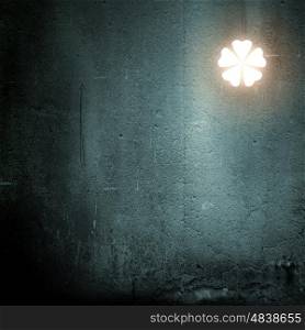 Five leaf clover. Background image with clover on dark background