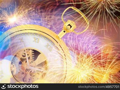 Five minutes to twelve. Conceptual image of clock with bokeh lights and firework