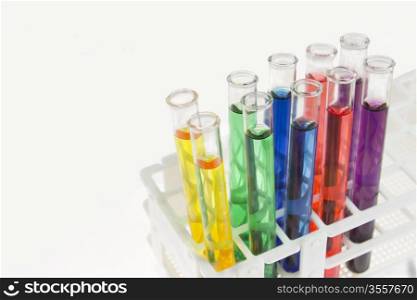 five pairs of brightly colored test tubes in a rack as a medical research concept