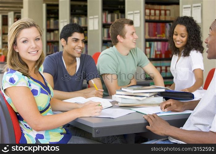 Five people in library studying (selective focus)