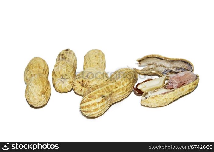 five pieces of peanuts, one piece is cracked, isolated on white background.