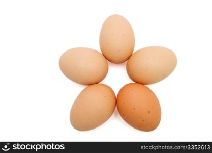 Five-pointed star of five brown eggs isolated