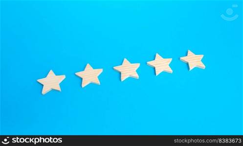 Five rating stars. Rating evaluation concept. High satisfaction. Popularity of restaurants, hotels or mobile applications. Highest score. Service quality feedback. Good reputation.