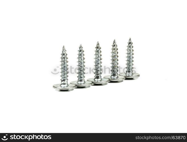 Five self-tapping screws of the same size on a light background