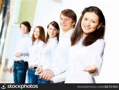Five students smiling. Image of five students in casual wear standing in row