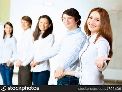 Five students smiling. Image of five students in casual wear standing in row