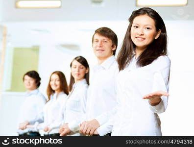 Five students smiling. Image of five students in casual wear standing in row