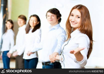 Five students smiling. Image of five students in casual wear standing in row