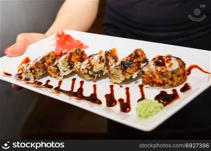 five sushi rolls on white plate. food