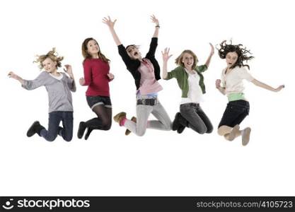Five teenage girls jumping in the air against white background