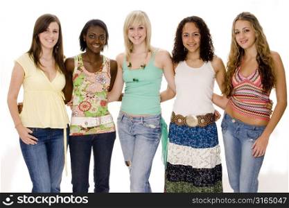 Five teenage girls standing together and smiling