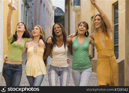 Five teenage girls with their arms around each other